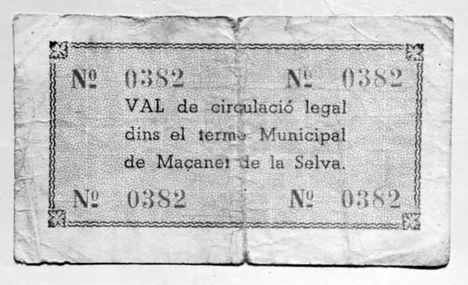 L'altra cara del bitllet d'una pesseta que emití l'Ajuntament de Maçanet igual que d'altres pobles, durant la Guerra Civil. La desaparició total de les monedes de curs legal ja a principis de la guerra l'any 1936, obligà als ajuntaments a emetre uns vals per facilitar les transaccions comercials.